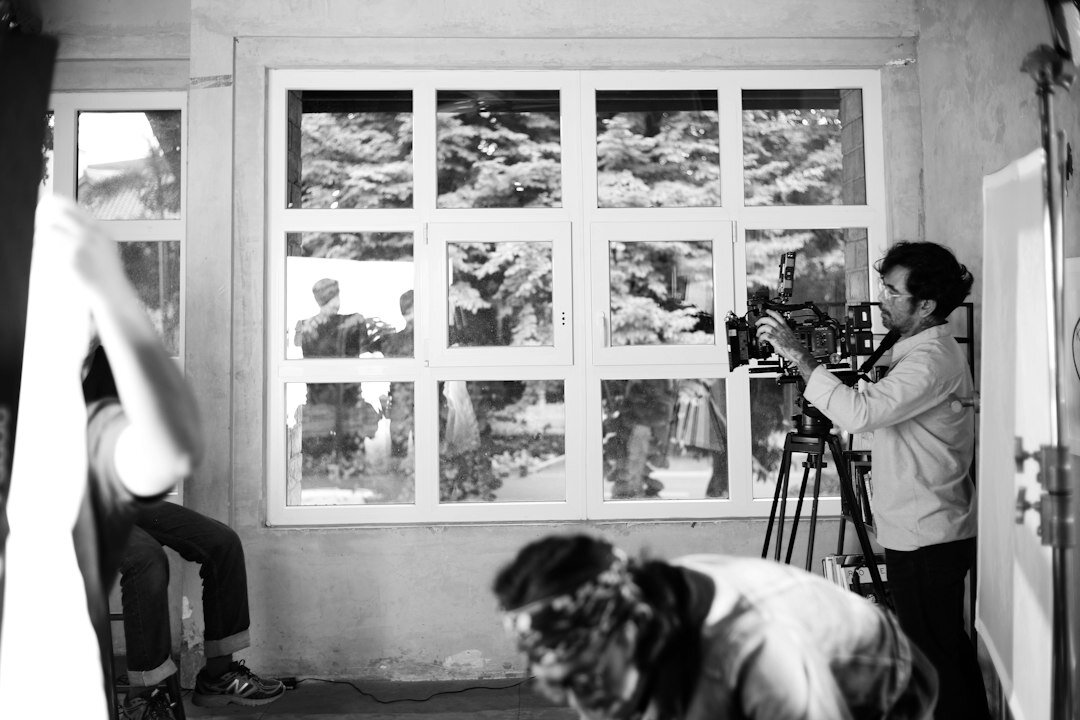 Production crew reviewing a shot list on a studio floor