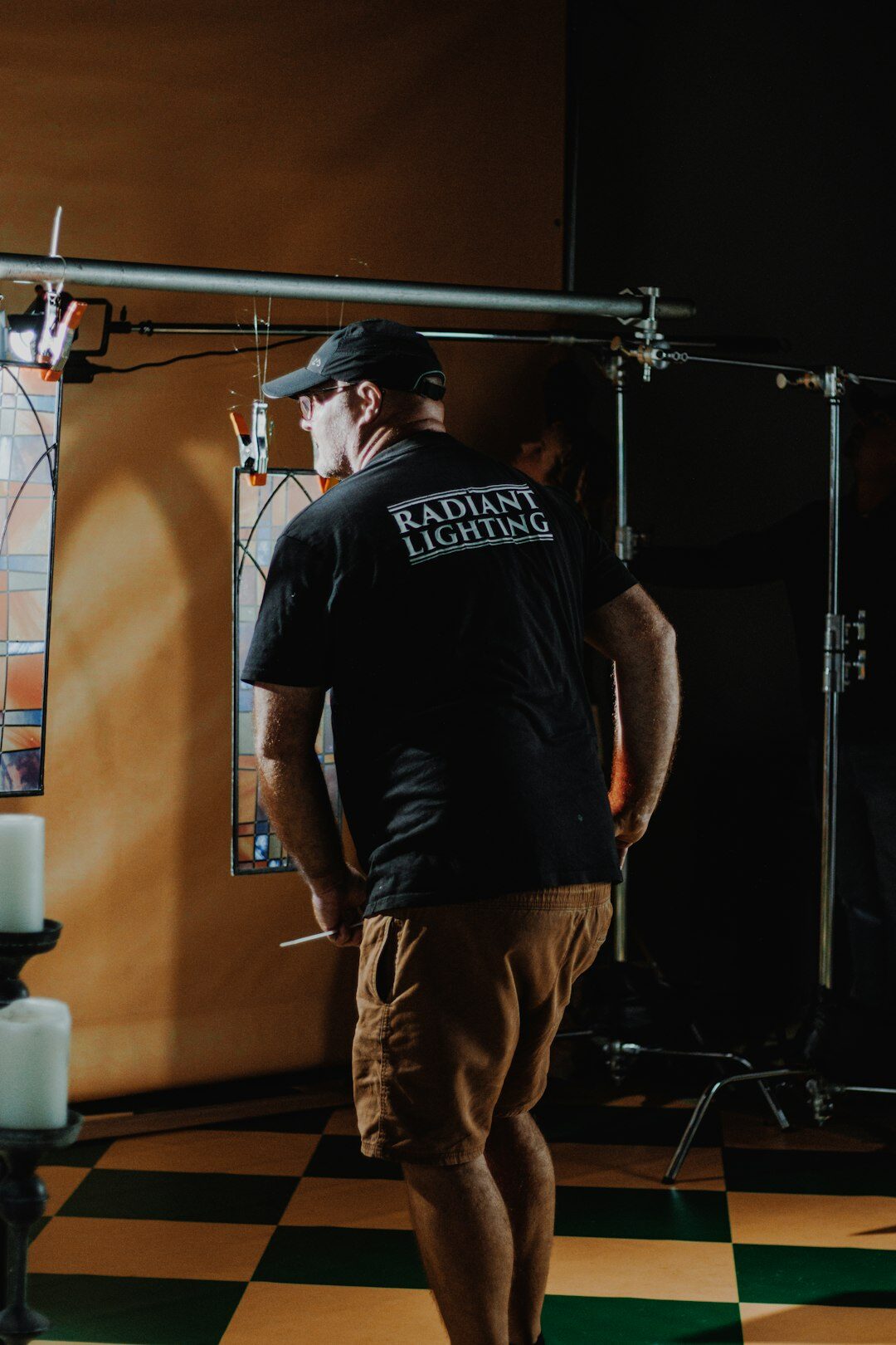 Crew installing camera rails and cabling in a new television studio
