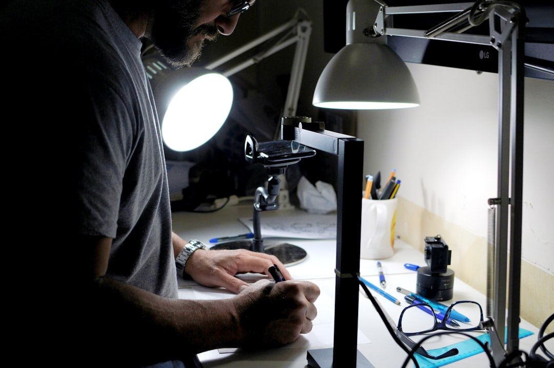 Lighting technician adjusting studio softbox lights